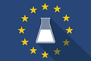Reagenzglas vor EU-Flagge 